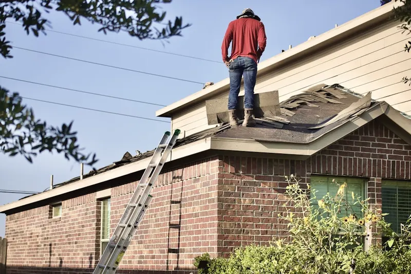 Professional roofer working on a residential roof in Spanish Trails Village